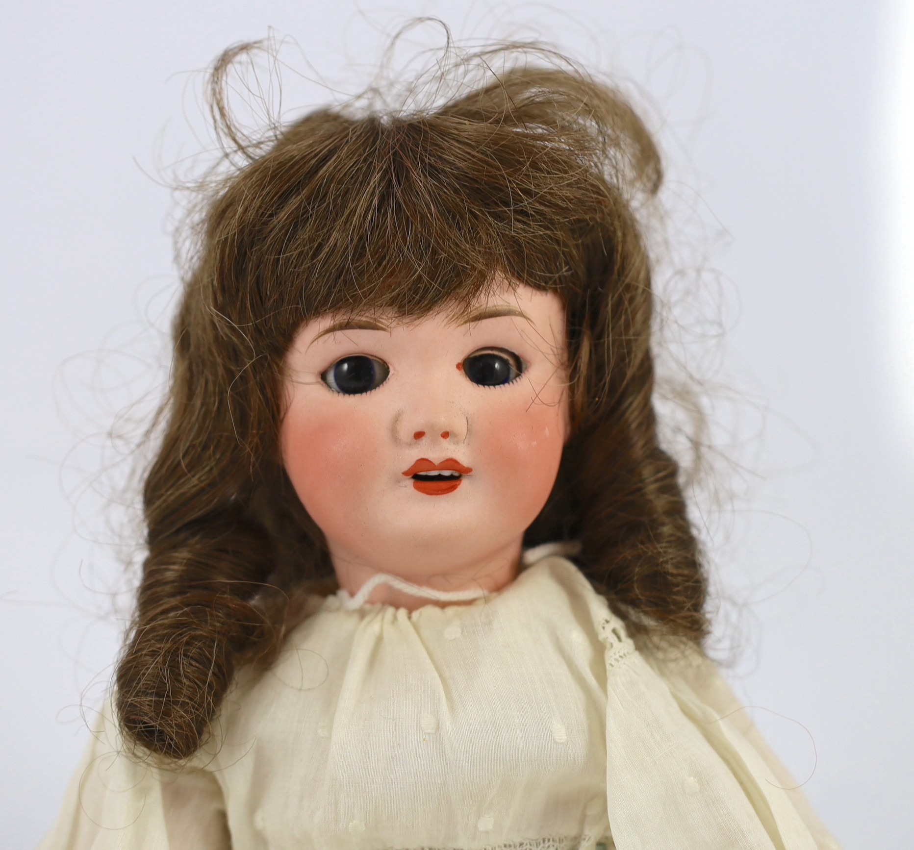 An SFBJ bisque doll, French, circa 1925, 16in.